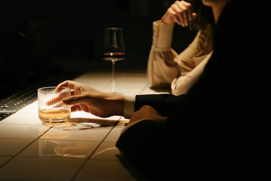 Couple sharing wine and tasting β aphrodisiac chocolate explained