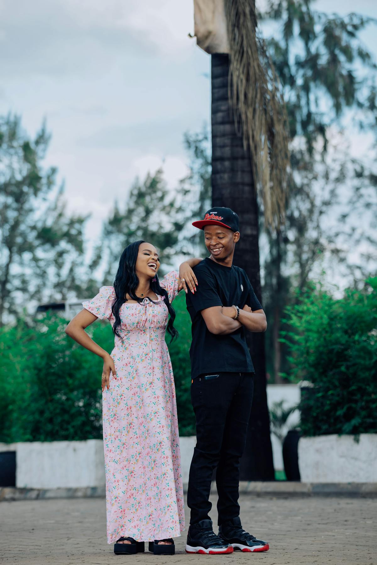 Couple laughing together outdoors — 30 date night ideas to break the routine