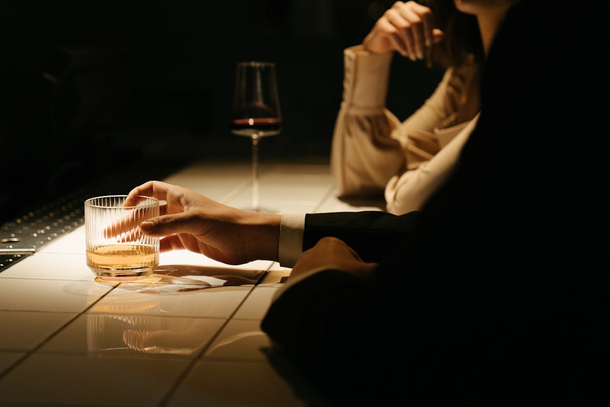 Couple sharing wine and tasting — aphrodisiac chocolate explained